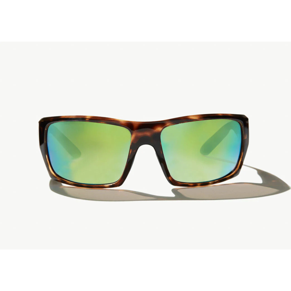 Brown tortoise shell Sunglasses with green-tinted lenses.