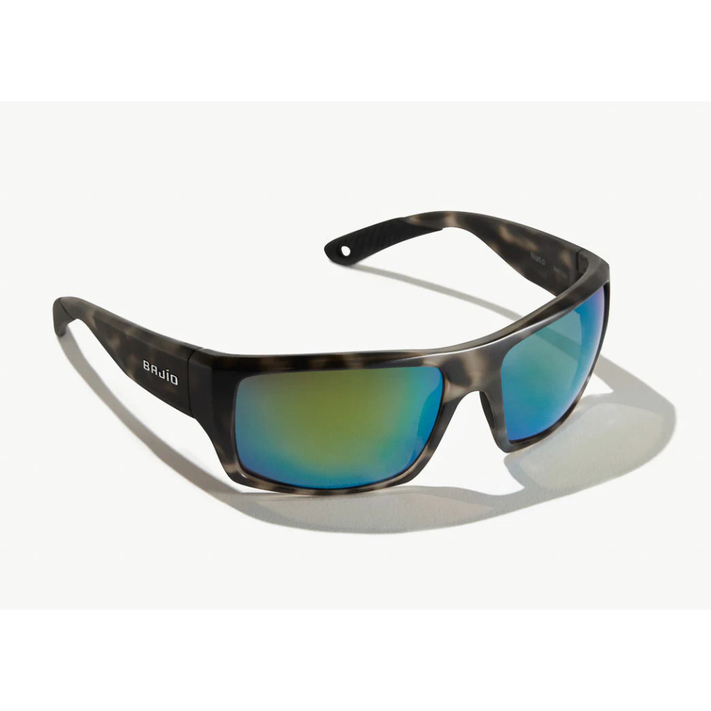 Sunglasses with a black tortoiseshell frame, blue-green lenses, and the bajio logo on the side.