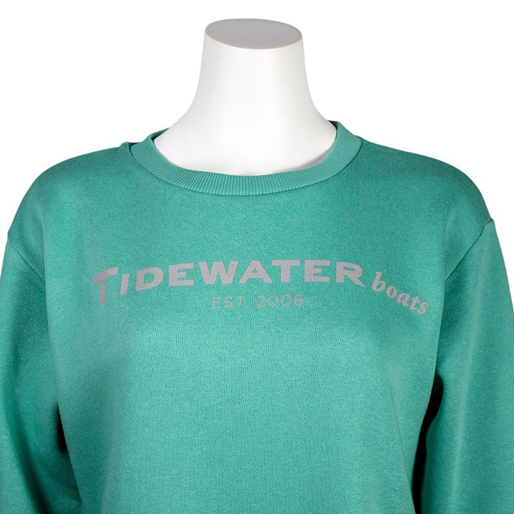 Close-up of a teal sweatshirt with the text 'Tidewater boats EST 2006' printed in gray on the chest.
