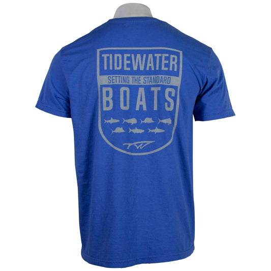 back of a blue t-shirt with a grey Tidewater Boats logo and fish graphics.