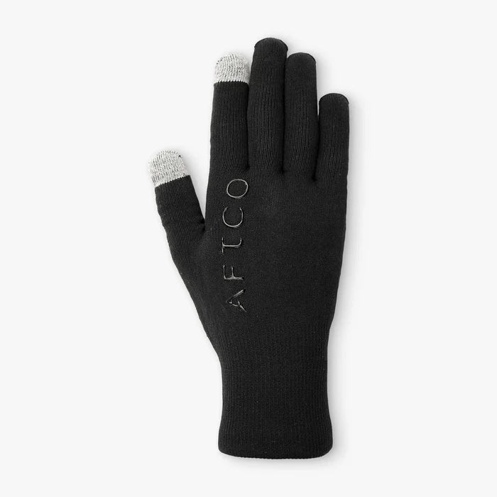 Back of a black knitted glove with touchscreen fingertips and an aftco label.