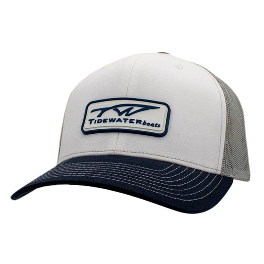 White and navy trucker hat with a rubber patch containing the Tidewater Boats logo.