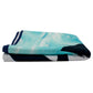 A thin, folded microfiber beach towel with blue and white pattern.